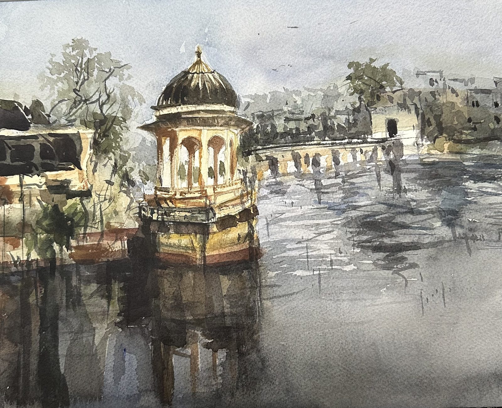 Domed chhatri reflected in a lake