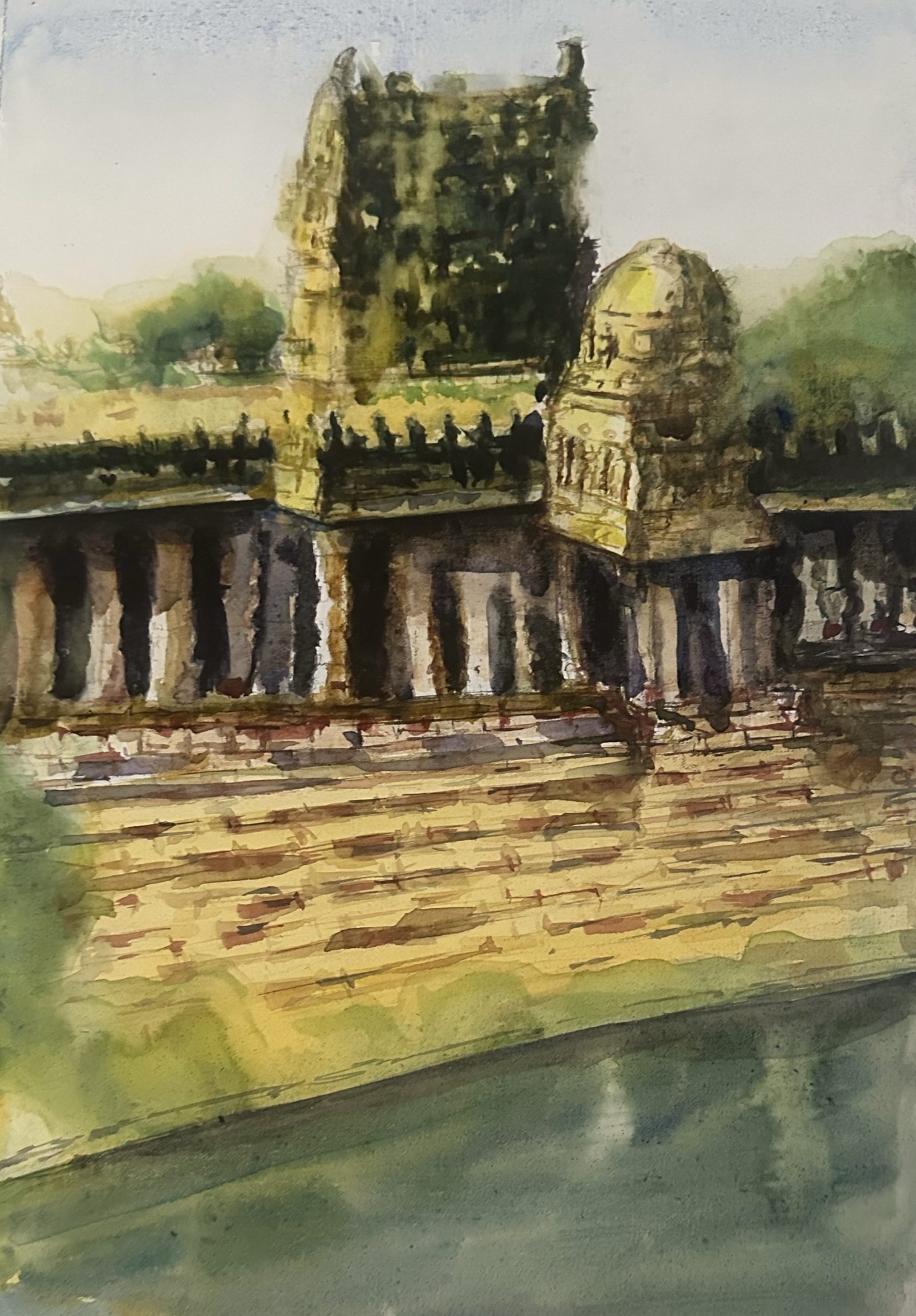 Temple towers above a river ghat