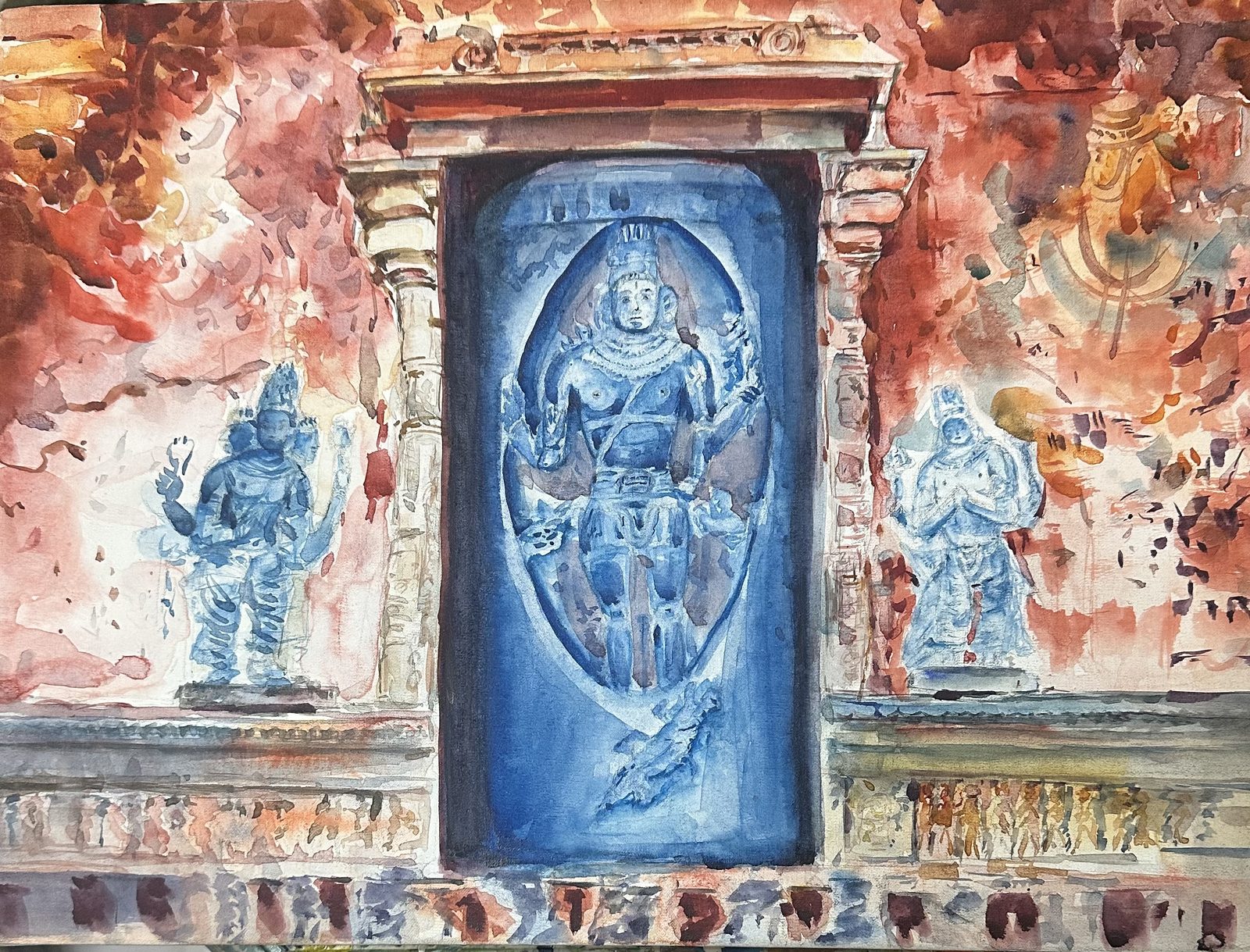 Blue relief figures on a temple wall